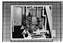Interior Mechanical View of Engine Room.  Diesel power GM Engine and walkway.  BW 4